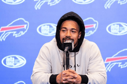 Khalil Shakir at a press conference smiling