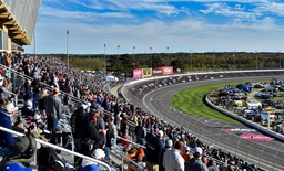 HAMPTON, GA &#8211; MARCH 19: Fans watch a pack of cars enter turn four during the Ambetter Health 400 in the NASCAR, Motorspo