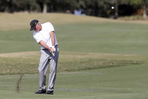 ORLANDO, FL &#8211; DECEMBER 13: Greg Norman hits to the 18th green during the Pro-Am of the 2018 PNC Father Son Challenge on