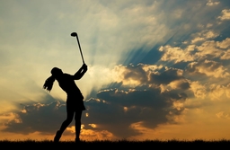 silhouette golfer playing golf during beautiful sunset (satitsrihin)