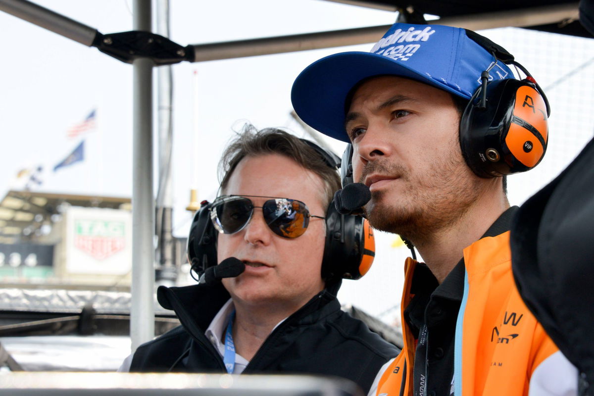 Syndication: The Indianapolis Star Jeff Gordon and Kyle Larson sit in the Arrow McLaren pit box Thursday, May 18, 2023,