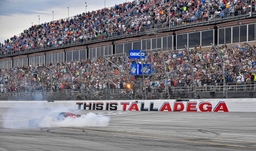 LINCOLN, AL &#8211; APRIL 23: Kyle Busch (8) does a burnout in the McLaren Custom Grills Chevrolet after winning the GEICO 500