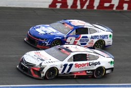 CHARLOTTE, NC &#8211; MAY 29: Denny Hamlin ( 11 Joe Gibbs Racing Clips Haircuts Toyota) races into turn 3 with Chase Elliott (
