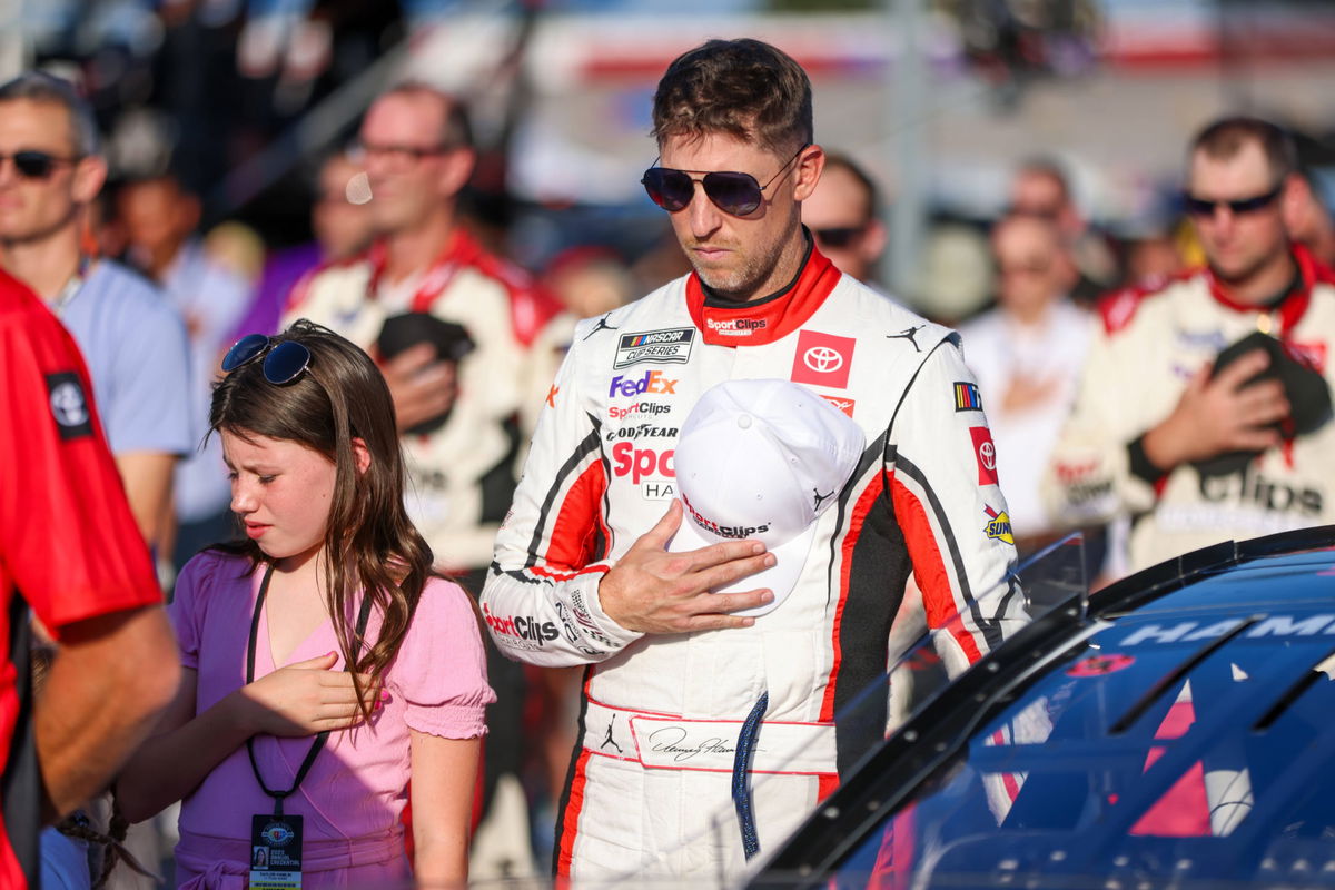 DARLINGTON, SC &#8211; SEPTEMBER 03: Denny Hamlin, driver of the 11 Clips Haircuts Toyota, stands during the National Anthem b