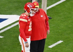 Kansas City Chiefs quarterback Patrick Mahomes talks to head coach Andy Reid before the start of Super Bowl LVIII agains