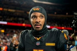 Washington Commanders quarterback Jayden Daniels (5) walks the field after a game against the Chicago Bears at Northwest