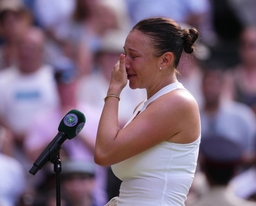 Amanda Anisimova of United States of America wipes away tears after the Ladies Singles Final on day thirteen of The Cham