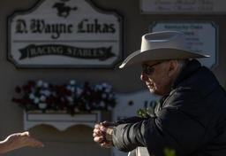 Syndication: The Courier-Journal Trainer D. Wayne Lukas, 88, talks with the media outside his barn on the backside of Ch