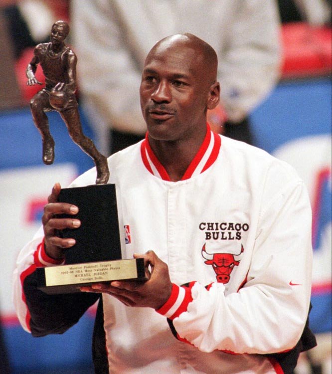 Michael Jordan with one of his five MVPs