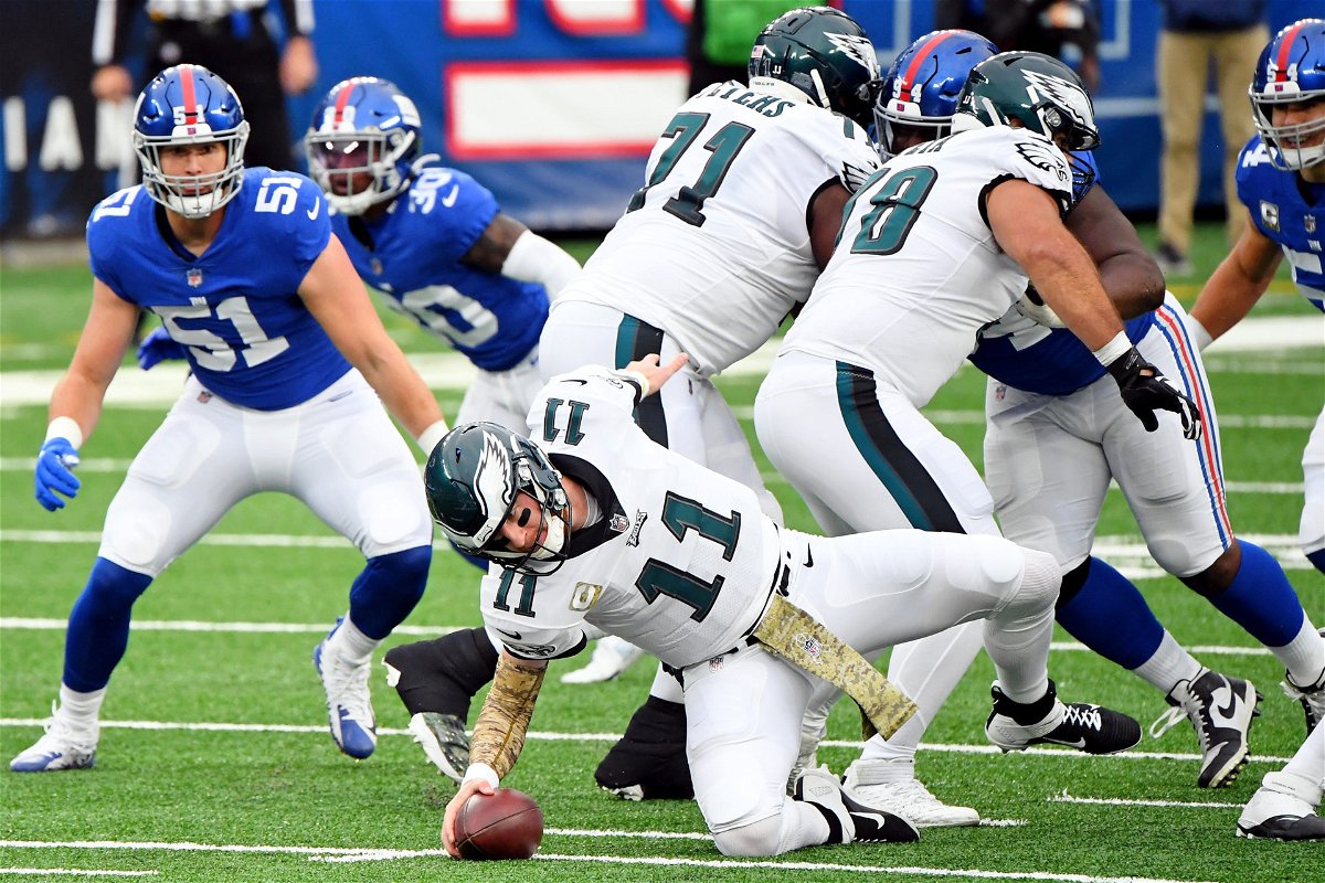 Philadelphia Eagles' Carson Wentz trips on a play against New York Giants